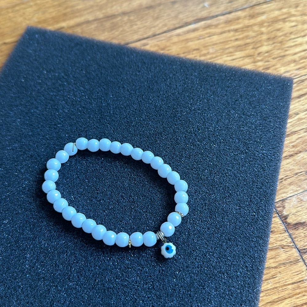White beaded evil eye bracelet